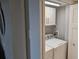 Closet laundry with washer and dryer, white cabinets, and gray walls at 4775 Cove Cir # 904, St Petersburg, FL 33708