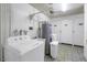 Shared laundry room with washer, dryer, and storage at 4775 Cove Cir # 904, St Petersburg, FL 33708