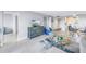Open concept living area with a view into the kitchen and dining area at 4775 Cove Cir # 904, St Petersburg, FL 33708