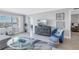 Bright living room with water views, comfortable seating, and stylish decor at 4775 Cove Cir # 904, St Petersburg, FL 33708