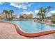 Community swimming pool with lounge chairs at 4775 Cove Cir # 904, St Petersburg, FL 33708