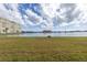 Scenic waterfront view with lush green grass at 4775 Cove Cir # 904, St Petersburg, FL 33708