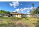 Beautiful yard with a screened porch and a fence at 5624 Mccoy Ct, Zephyrhills, FL 33542