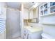Bathroom with a shower, vanity sink, and medicine cabinet at 5624 Mccoy Ct, Zephyrhills, FL 33542