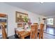 Dining space with a wooden table, chairs, and wood-look tile floors at 5624 Mccoy Ct, Zephyrhills, FL 33542