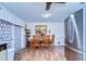 Cozy dining area featuring a wooden table and stainless steel refrigerator at 5624 Mccoy Ct, Zephyrhills, FL 33542