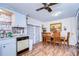 Charming dining area with hardwood floors, wooden table and chairs at 5624 Mccoy Ct, Zephyrhills, FL 33542