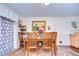 Inviting dining room featuring a wooden table and chairs, complemented by stylish decor at 5624 Mccoy Ct, Zephyrhills, FL 33542