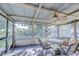 Enclosed patio boasts a ceiling fan and provides a pleasant place to relax and enjoy the outdoors at 5624 Mccoy Ct, Zephyrhills, FL 33542