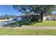 Charming single-story home with a well-maintained front lawn and attached garage at 6425 Rosewood Dr, Tampa, FL 33615