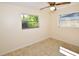 Bedroom features tile floors, natural light from two windows, and neutral walls at 9567 85Th St, Seminole, FL 33777