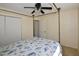 This bedroom showcases a canopy bed, tile floors and closet providing comfortable living at 9567 85Th St, Seminole, FL 33777
