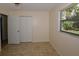 Bedroom features tile floors, closet and a window for natural light at 9567 85Th St, Seminole, FL 33777