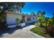 Inviting exterior showcasing a quaint, single-story home and tidy front yard landscaping at 9567 85Th St, Seminole, FL 33777