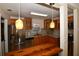 Bright kitchen featuring stainless steel appliances, wood cabinets, granite countertops, and a convenient breakfast bar at 9567 85Th St, Seminole, FL 33777