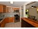 Well-lit kitchen boasts stainless steel appliances, granite countertops, and a seamless transition to the dining area at 9567 85Th St, Seminole, FL 33777