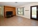 Comfortable living room with wood-paneled wall, tile flooring, and a cozy atmosphere at 9567 85Th St, Seminole, FL 33777