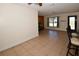 Inviting living room with tile floors, a wood-paneled accent wall, and natural light at 9567 85Th St, Seminole, FL 33777