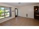 Bright living room with tile floors, a large window, and a view into the kitchen area at 9567 85Th St, Seminole, FL 33777