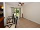 Bright living area with tile floors, a ceiling fan, and seamless access to outdoor views at 9567 85Th St, Seminole, FL 33777