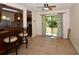 Open layout of Living room and kitchen, featuring tile floors and natural lighting at 9567 85Th St, Seminole, FL 33777