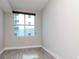 Bright bedroom with large window, neutral walls, and wood-style flooring at 1120 E Kennedy Blvd # 927, Tampa, FL 33602