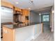 Open kitchen with granite countertops, stainless steel appliances, and wood cabinets at 1120 E Kennedy Blvd # 927, Tampa, FL 33602