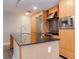 Sleek kitchen featuring stainless steel appliances, granite countertops, and wood cabinetry at 1120 E Kennedy Blvd # 927, Tampa, FL 33602