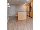 Modern kitchen with stainless steel appliances, large island, and wood-style flooring at 1120 E Kennedy Blvd # 927, Tampa, FL 33602