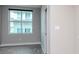 Bright living room with large window, wood-style flooring, and sliding door at 1120 E Kennedy Blvd # 927, Tampa, FL 33602