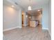 Open concept living area with kitchen island, washer/dryer, and wood-style flooring at 1120 E Kennedy Blvd # 927, Tampa, FL 33602