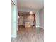Open plan living and dining area with kitchen island and wood-style flooring at 1120 E Kennedy Blvd # 927, Tampa, FL 33602