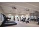 Modern fitness center with treadmills, stationary bikes, and weights at 11869 Blue Diamond Trl, Parrish, FL 34219