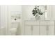 Bright, clean bathroom with white vanity, modern fixtures, and decorative accents at 12430 Sweet Angel Aura Way, Parrish, FL 34219