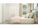 Inviting bedroom with a cozy bed, neutral colors, and simple decor at 12430 Sweet Angel Aura Way, Parrish, FL 34219