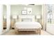 Serene bedroom with a comfortable bed, stylish decor, and soft lighting at 12430 Sweet Angel Aura Way, Parrish, FL 34219