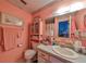 Clean bathroom with pink walls and a shower/tub combo at 1901 Canterbury Ln # 19, Sun City Center, FL 33573