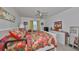 Bright bedroom with a ceiling fan and ample closet space at 1901 Canterbury Ln # 19, Sun City Center, FL 33573
