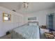 Light and airy bedroom with ceiling fan and built-in shelving at 1901 Canterbury Ln # 19, Sun City Center, FL 33573