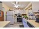 Efficient kitchen with white cabinets and modern appliances at 1901 Canterbury Ln # 19, Sun City Center, FL 33573