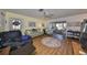 Bright living room featuring hardwood floors and ample natural light at 1901 Canterbury Ln # 19, Sun City Center, FL 33573