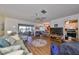 Spacious living room with hardwood floors and access to a screened patio at 1901 Canterbury Ln # 19, Sun City Center, FL 33573