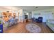 Living room features hardwood floors, comfy seating and a large TV at 1901 Canterbury Ln # 19, Sun City Center, FL 33573