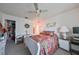 Main bedroom with large bed, dresser, closet, and ceiling fan at 1901 Canterbury Ln # 19, Sun City Center, FL 33573