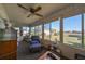 Relaxing sunroom with wicker furniture and view of backyard at 1901 Canterbury Ln # 19, Sun City Center, FL 33573