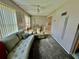 Cozy living room featuring a comfortable sofa, recliner and soft gray carpet at 2403 Finlandia Ln # 57, Clearwater, FL 33763