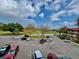 Scenic view of the parking lot with well maintained landscaping and an adjacent golf course at 2403 Finlandia Ln # 57, Clearwater, FL 33763
