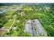 Aerial view of the community, pool, parking area, and surrounding landscape at 2632 River Preserve Ct, Bradenton, FL 34208