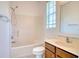 Bathroom with a shower/tub combo, vanity, and window at 2632 River Preserve Ct, Bradenton, FL 34208