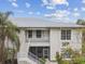 Charming two-story condo with a private balcony, palm trees, and white trim at 2632 River Preserve Ct, Bradenton, FL 34208